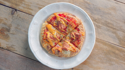top view mini pizza on wooden bacground