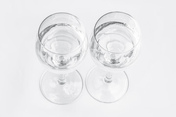 Two glasses on a white background.