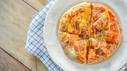 delicious pizza detail on white plate close up view
