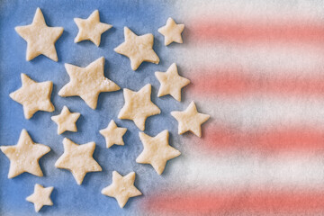 handmade cookies in the shape of stars on parchment paper in the form of an American flag