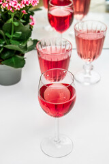 Pink drink in glasses. Pink flowers.