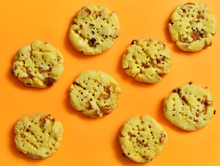 Delicious homemade cookies on an orange background