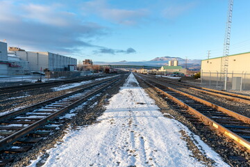 Snow covered railway, under blue sky