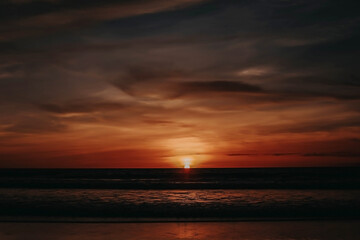Fototapeta na wymiar Colourful Sunset on a Tropical Island Bali. Amazing Sunset Beach Endless Colourful Horizon and the Ocean Background. Sunset Gradient