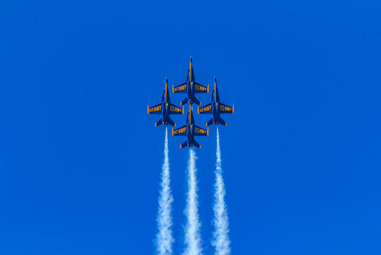 United States Navy Blue Angels aerobatic team's F-18 Hornet combat jets In flight at Fleet Week San Francisco, USA