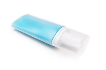 A blue plastic conteiner, bottle of moisturising cream, lotion with dosator and cap isolated on white background
