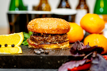 A classic Burger with a cutlet lies between two sesame buns.