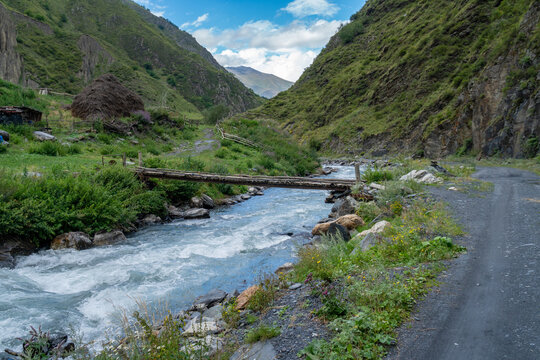 Old wooden bridge over a river Argun in Upper Khevsureti, Georgia