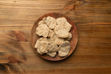 Raw Dehydrated Soy Meat or Soya Chunks on Wood Background