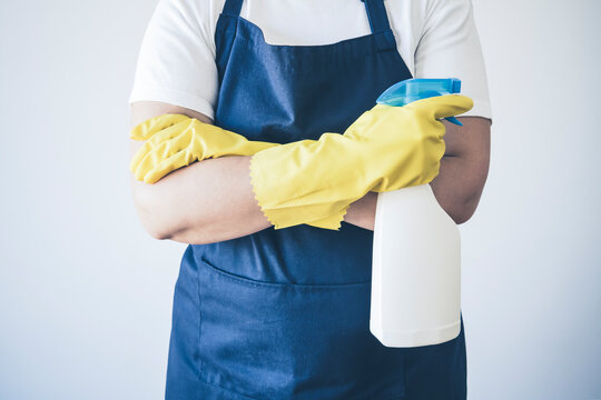 Close-Up Of A woman cleaner With Cleaning and Disinfecting Equipments