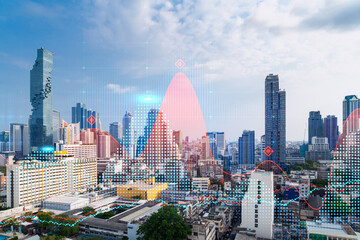 Fototapeta premium Forex and stock market chart hologram over panorama city view of Bangkok, the financial center in Asia. The concept of international trading. Double exposure.