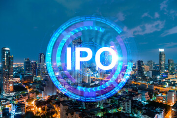 Initial public offering hologram, night panoramic city view of Bangkok. The financial center for multinational corporations in Asia. The concept of boosting the growth by IPO process. Double exposure.