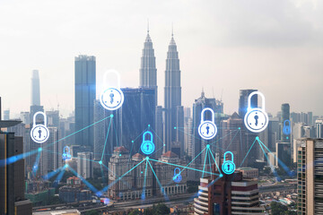 Padlock icon hologram over panorama city view of Kuala Lumpur to protect business, Malaysia, Asia. The concept of information security shields. Double exposure.