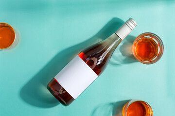 Wineglasses of wine and mock-up bottle of rose wine.