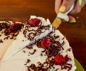 Raspberry Cake for holidays. Cutting Raspberry Cake
