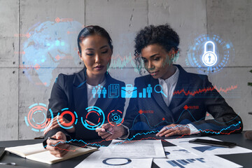 Two businesswomen work together in modern office on new project. Double exposure. Concept of success.