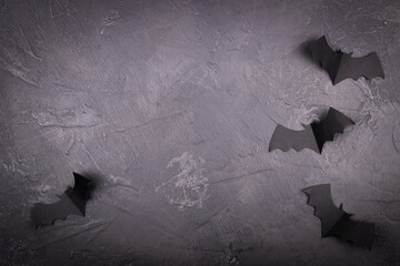 Black marble surface with paper bats