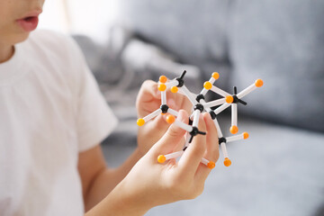 boy, kid plays with the details of the constructor, creates new toys, the concept of the development of mental abilities, logic, spatial representations, family entertainment