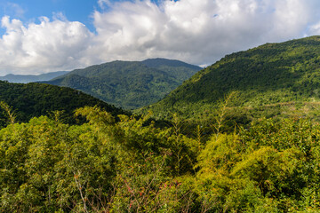 Panoramic view to mountains, tropical forest, Yanoda Park and Sanya city. Rainforest cultural tourism zone Yanoda, Hainan, China.
