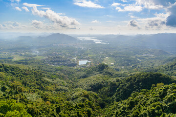 Obraz premium Panoramic view to mountains, tropical forest, Yanoda Park and Sanya city. Rainforest cultural tourism zone Yanoda, Hainan, China.