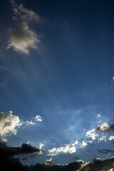 Sky with ray lights and clouds