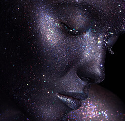 Portrait of beautiful woman with art space makeup on her face and body. Glitter Face.