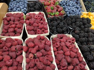 sale of berries in the store: raspberries, blueberries, blackberries, strawberries. black, red,...