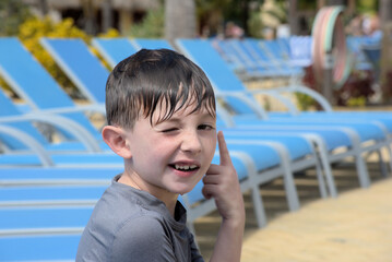 boy poolside wet