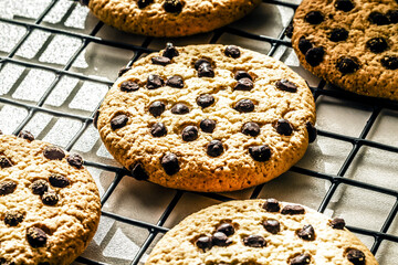 Delicious Fresh Chocolate Chip Cookies with chocolate on a Cooling Rack, Close up