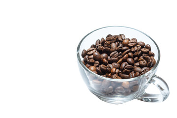 transparent cup full of roasted coffee beans on a white background.