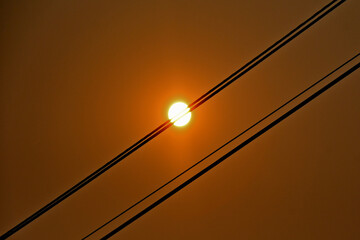 Diffraction of light around solid transmission wire makes it appear the wire is thinning