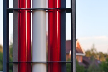 multicolored tubes of street lamp on blurred background