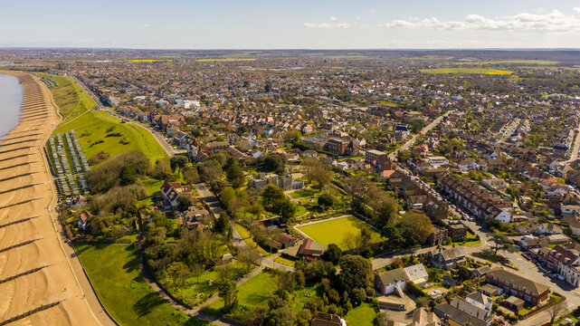 An aerial view of an empty sandy beach. Pandemic quarantine. Whitstable, Kent, UK