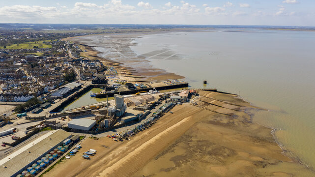 An aerial view of an empty sandy beach. Pandemic quarantine. Whitstable, Kent, UK