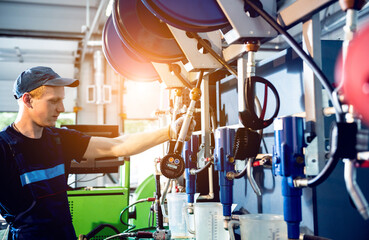 Car mechanic change engine oil. Car repair. Service station