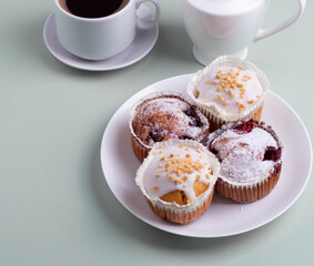 yummy sweet tasty muffin cakes on simple mono color background