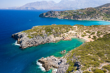 Aerial view of the rocky coastline and Aegean Sea near Voulisma, Crete, Greece