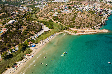 Fototapeta premium Aerial view of Almyros beach near the town of Agios Nikolaos in Crete, Greece
