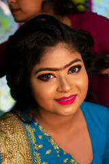 an indian teenage girl taking hair spa at a beauty salon