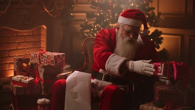 Santa Claus holding old scroll of parchment, . Letter, blank