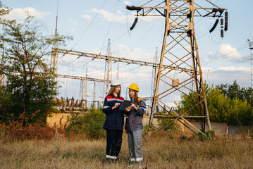 Women's collective of energy workers conducts an inspection of equipment and power lines. Energy