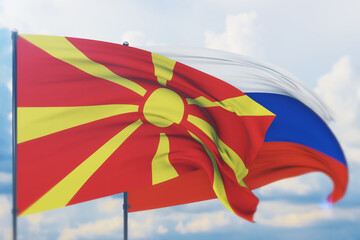Waving Russian flag and flag of North Macedonia. Closeup view, 3D illustration.