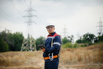 An energy worker inspects power lines. Energy