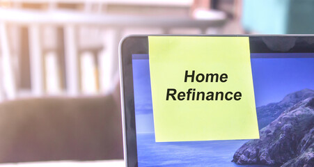 top view of words note on laptop computer screen with Home refinance text