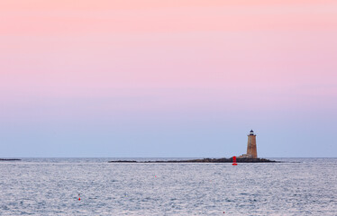 Portsmouth Harbor Lighthouse after sunset. The lighthouse is a historic lighthouse located within...