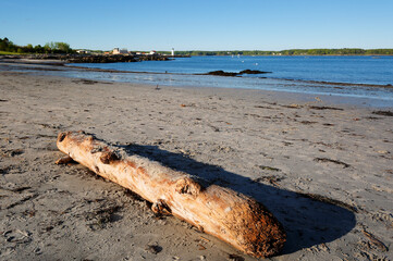 Portsmouth Harbor Lighthouse at Sunset with low tide. Portsmouth Harbor Lighthouse is a historic...