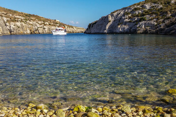 Yacht moored in the hidden bay of Mgarr Ix-Xini, Gozo, Malta