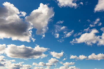 Beautiful View of Puffy White Clouds with blue Sky in Background during a sunny summer day. Taken in Yukon, Canada.