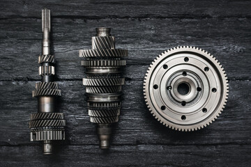 Primary and secondary shaft of the car gearbox on black background.
