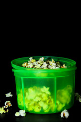 Green box with popcorn on black background
